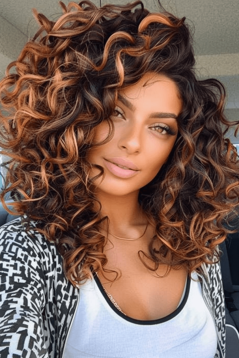 Voluminous Curly Hairstyles with Caramel Highlights
