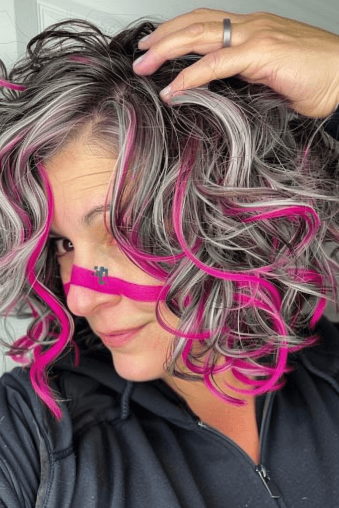 Gray Curly Bob with Bright Pink Highlights