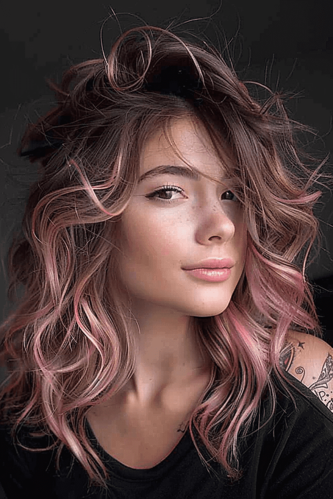 Fluffy Brunette Hair with Pink Highlights for women with a messy hairdo